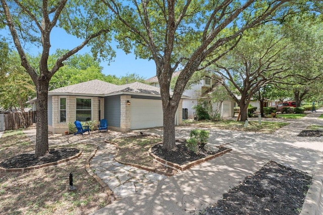 9273 Vigen Cir, Austin, TX 78748 - view of front of house featuring an attached garage and driveway