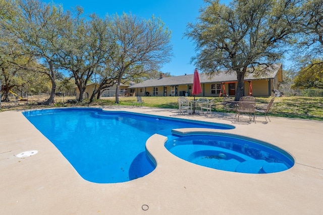 2700 County Road 224, Florence, TX 76527 - view of pool with a patio, a lawn, and a pool with connected hot tub