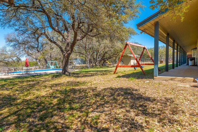 2700 County Road 224, Florence, TX 76527 - view of yard featuring a playground and an outdoor pool