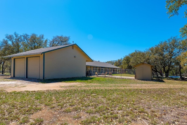 2700 County Road 224, Florence, TX 76527 - view of yard with a detached garage and a storage shed