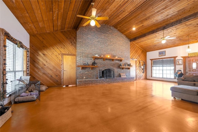 2700 County Road 224, Florence, TX 76527 - unfurnished living room with a ceiling fan, a wooden ceiling with exposed beams, high vaulted ceiling, wood walls, and a fireplace