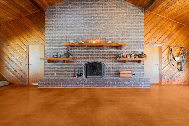 2700 County Road 224, Florence, TX 76527 - unfurnished living room with wooden walls, wood ceiling, a brick fireplace, and high vaulted ceiling