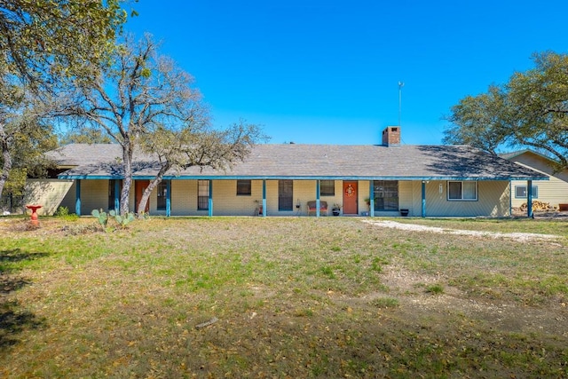 2700 County Road 224, Florence, TX 76527 - view of front facade featuring a chimney, covered porch, and a front yard