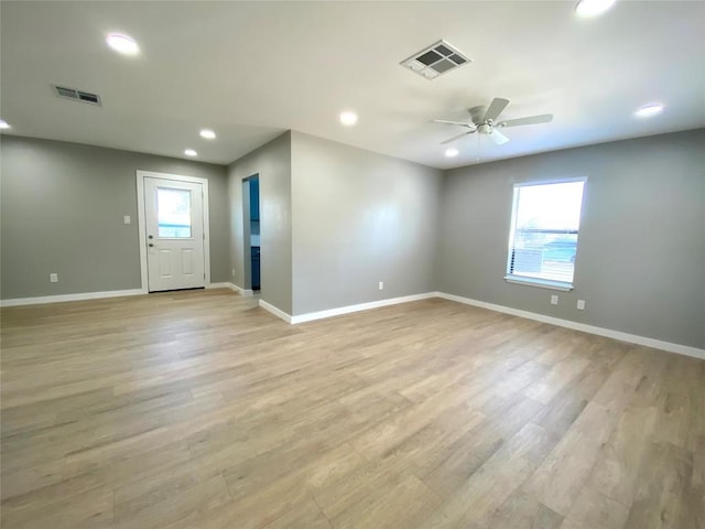 6920 Bethune Ave, Austin, TX 78752 - empty room with light wood finished floors, ceiling fan, and recessed lighting