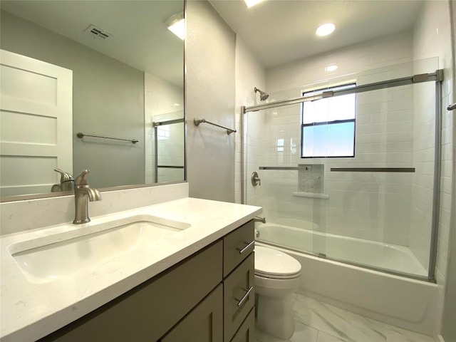 6920 Bethune Ave, Austin, TX 78752 - bathroom featuring vanity, combined bath / shower with glass door, marble finish flooring, and recessed lighting