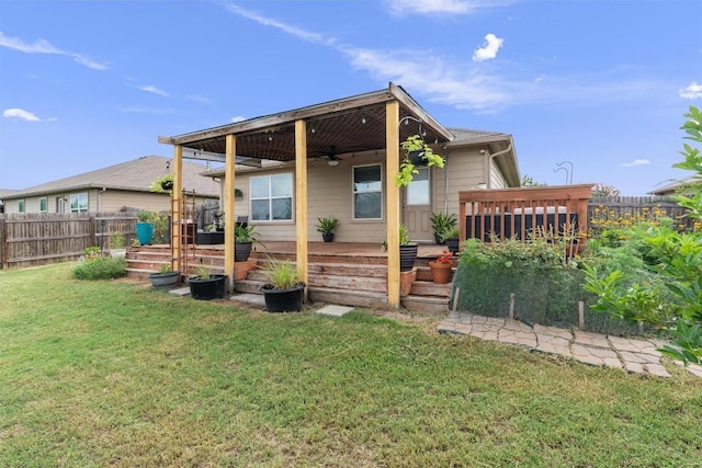 233 Voss, Kyle, TX 78640 - rear view of house featuring a vegetable garden and ceiling fan