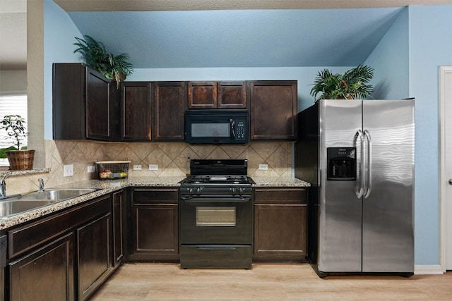 233 Voss, Kyle, TX 78640 - kitchen featuring black appliances, dark brown cabinets, light wood finished floors, and backsplash