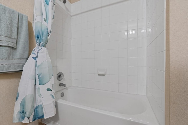 233 Voss, Kyle, TX 78640 - full bath with a textured wall and shower / tub combo