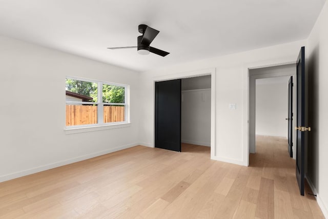 1405 Ridgehaven Dr, Austin, TX 78723 - unfurnished bedroom with light wood-type flooring, a closet, and a ceiling fan