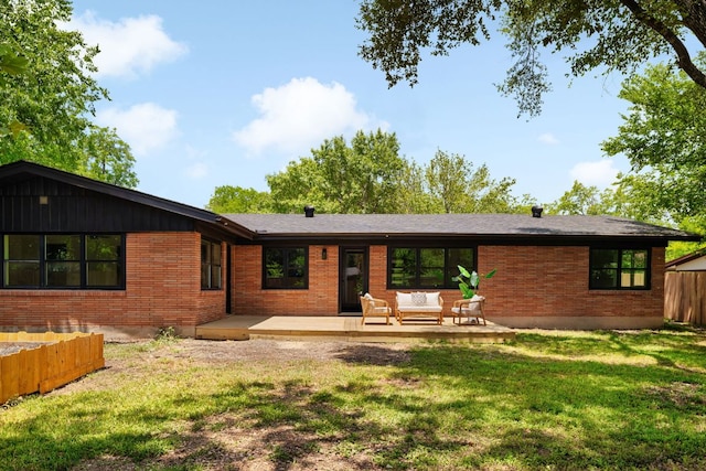1405 Ridgehaven Dr, Austin, TX 78723 - back of house with an outdoor living space, a deck, and brick siding