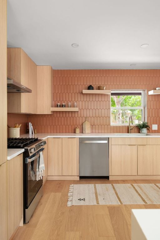 1405 Ridgehaven Dr, Austin, TX 78723 - kitchen featuring stainless steel appliances, light brown cabinets, modern cabinets, and recessed lighting