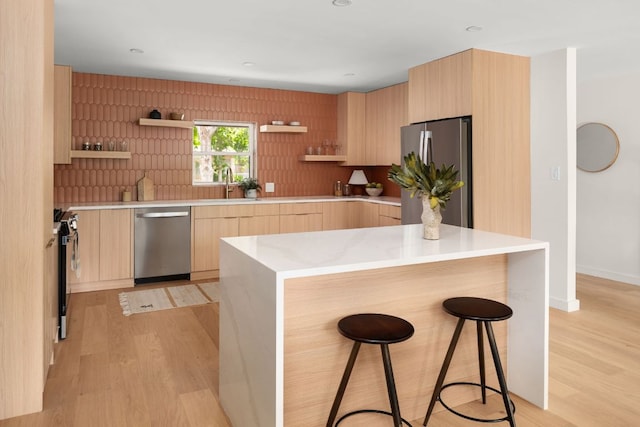 1405 Ridgehaven Dr, Austin, TX 78723 - kitchen with appliances with stainless steel finishes, open shelves, modern cabinets, light brown cabinets, and light wood-style flooring