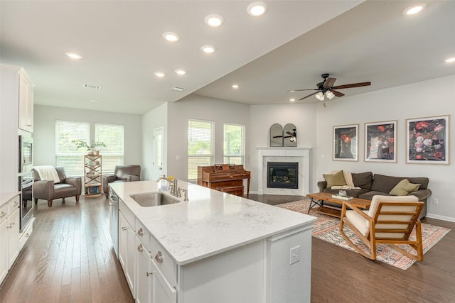 2049 Cartway Ct, Leander, TX 78641 - kitchen featuring open floor plan, appliances with stainless steel finishes, plenty of natural light, white cabinets, and recessed lighting