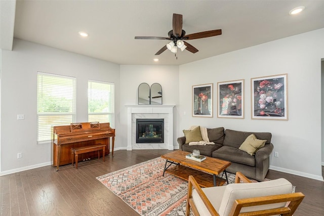 2049 Cartway Ct, Leander, TX 78641 - living room with a ceiling fan, a high end fireplace, wood finished floors, and recessed lighting
