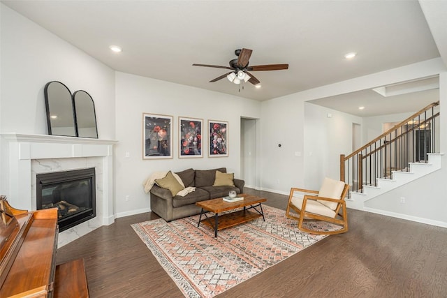 2049 Cartway Ct, Leander, TX 78641 - living room with dark wood-style flooring, ceiling fan, recessed lighting, a premium fireplace, and stairway
