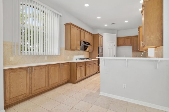 3213 Summer Canyon Dr, Austin, TX 78732 - kitchen featuring appliances with stainless steel finishes, light countertops, custom range hood, a peninsula, and recessed lighting