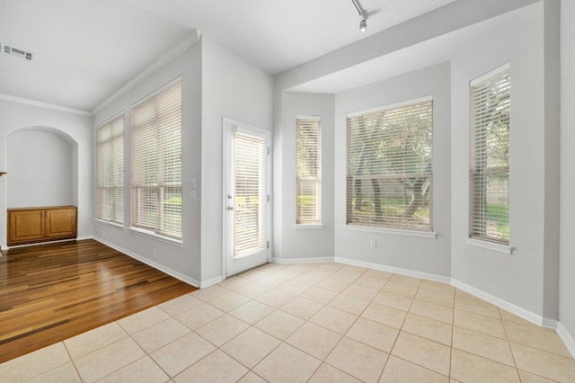 3213 Summer Canyon Dr, Austin, TX 78732 - tiled spare room with crown molding and baseboards