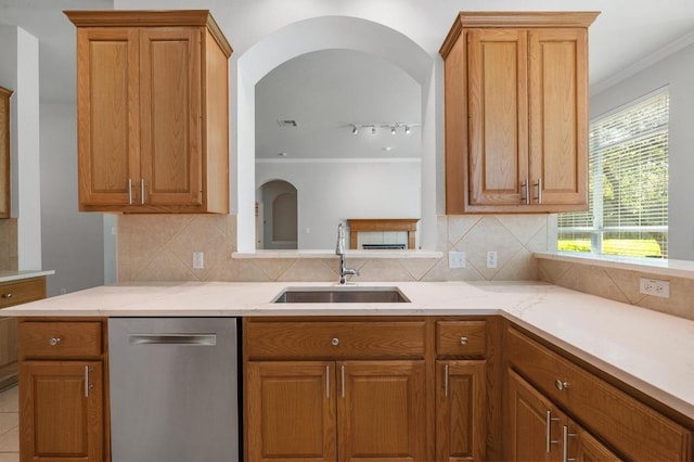 3213 Summer Canyon Dr, Austin, TX 78732 - kitchen with stainless steel dishwasher, light stone counters, tasteful backsplash, and crown molding