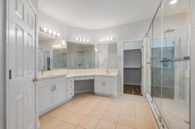 3213 Summer Canyon Dr, Austin, TX 78732 - full bath featuring tile patterned flooring, a shower stall, double vanity, and a walk in closet