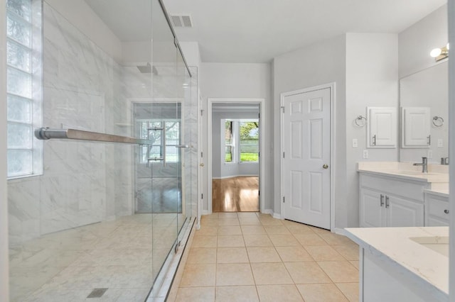 3213 Summer Canyon Dr, Austin, TX 78732 - bathroom with vanity, a marble finish shower, and tile patterned floors