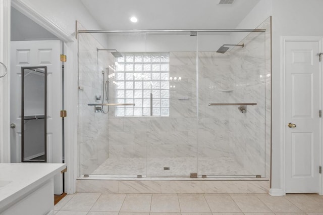 3213 Summer Canyon Dr, Austin, TX 78732 - bathroom featuring a marble finish shower, vanity, tile patterned flooring, and recessed lighting