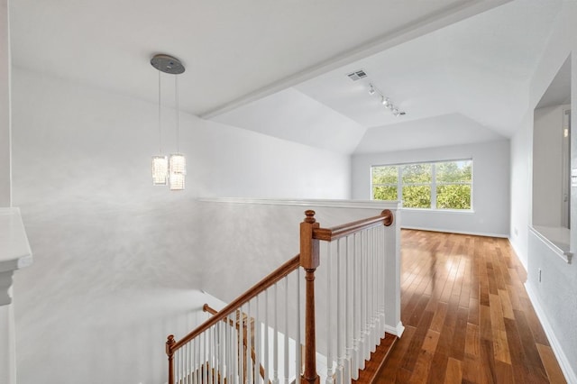 3213 Summer Canyon Dr, Austin, TX 78732 - hall featuring vaulted ceiling, an upstairs landing, rail lighting, hardwood / wood-style flooring, and a chandelier
