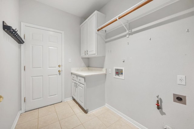 3213 Summer Canyon Dr, Austin, TX 78732 - washroom featuring hookup for an electric dryer, hookup for a gas dryer, cabinet space, light tile patterned flooring, and washer hookup