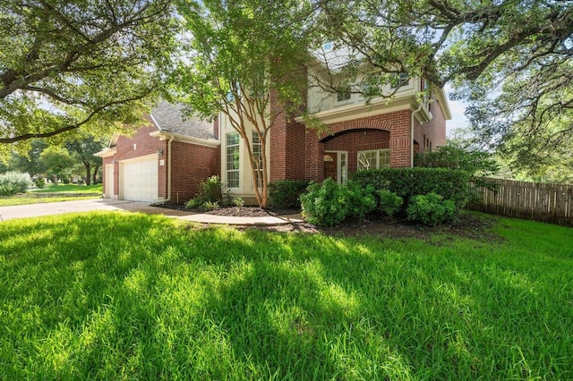 3213 Summer Canyon Dr, Austin, TX 78732 - obstructed view of property featuring brick siding, an attached garage, and driveway
