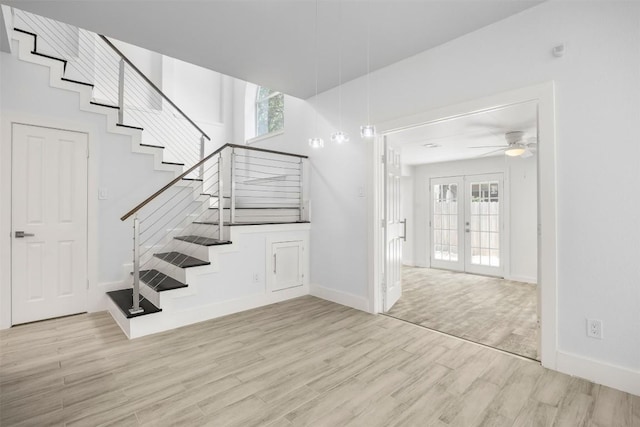 8104 Broken Branch Dr, Round Rock, TX 78681 - stairway with wood finished floors, plenty of natural light, ceiling fan, and french doors