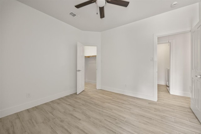8104 Broken Branch Dr, Round Rock, TX 78681 - empty room featuring ceiling fan, light wood-style floors, and a smoke detector
