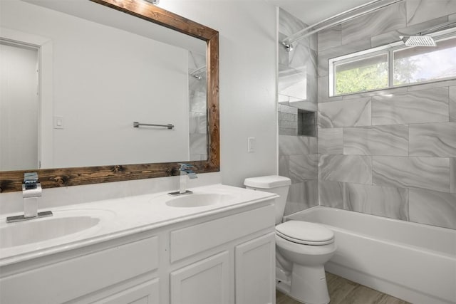8104 Broken Branch Dr, Round Rock, TX 78681 - full bath featuring double vanity,  shower combination, and wood finished floors