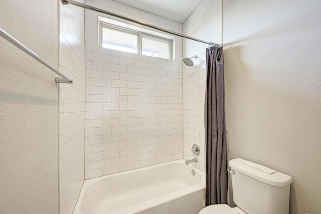 600 E Baylee Love Ln, Austin, TX 78717 - bathroom featuring shower / bath combo with shower curtain and a textured wall