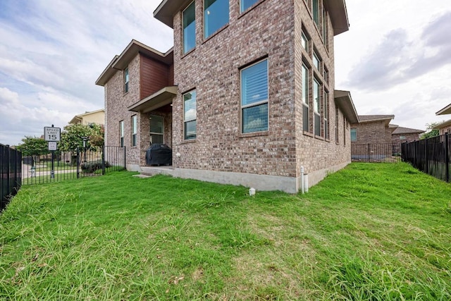 600 E Baylee Love Ln, Austin, TX 78717 - back of house featuring brick siding and a fenced backyard