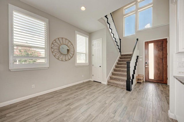 600 E Baylee Love Ln, Austin, TX 78717 - foyer entrance with stairway, light wood-type flooring, and recessed lighting