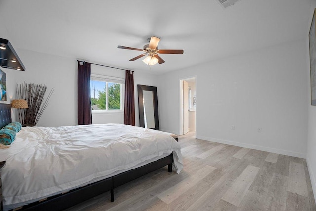 7625 Cayenne Ln, Austin, TX 78741 - bedroom with wood finished floors and a ceiling fan