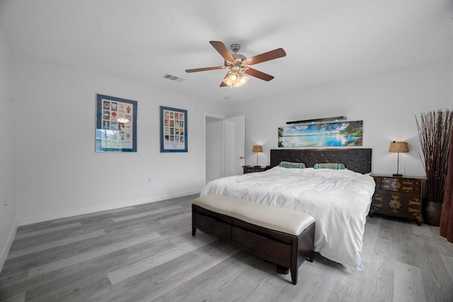 7625 Cayenne Ln, Austin, TX 78741 - bedroom featuring wood finished floors and a ceiling fan