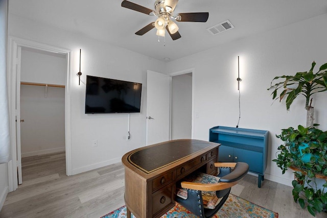 7625 Cayenne Ln, Austin, TX 78741 - office space featuring light wood finished floors and a ceiling fan