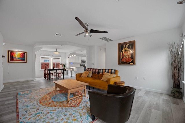 7625 Cayenne Ln, Austin, TX 78741 - living room featuring a ceiling fan and wood finished floors