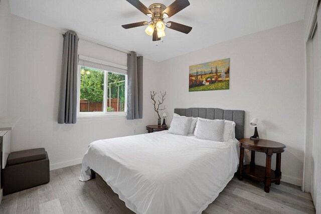 7625 Cayenne Ln, Austin, TX 78741 - bedroom with wood finished floors and ceiling fan