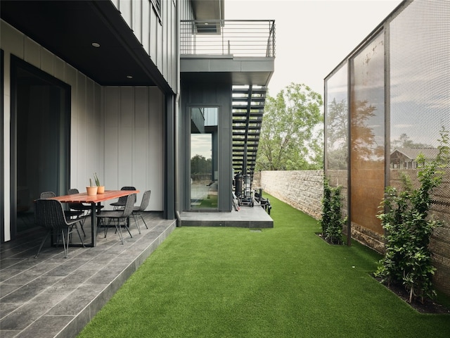412 Kemp St, Austin, TX 78741 - fenced backyard with a balcony, a patio area, and outdoor dining area