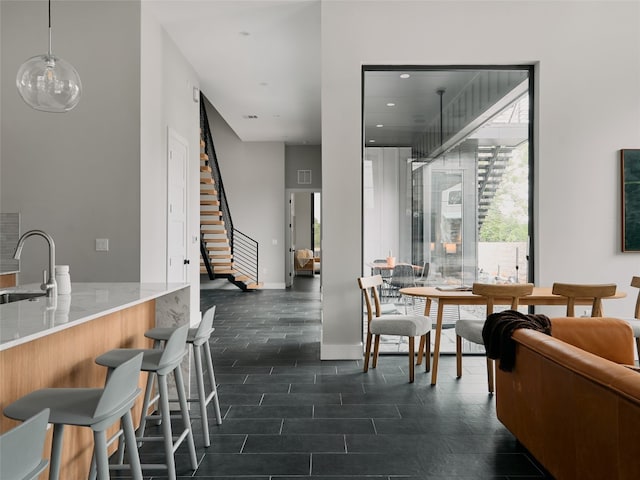 412 Kemp St, Austin, TX 78741 - dining space featuring stairs and recessed lighting