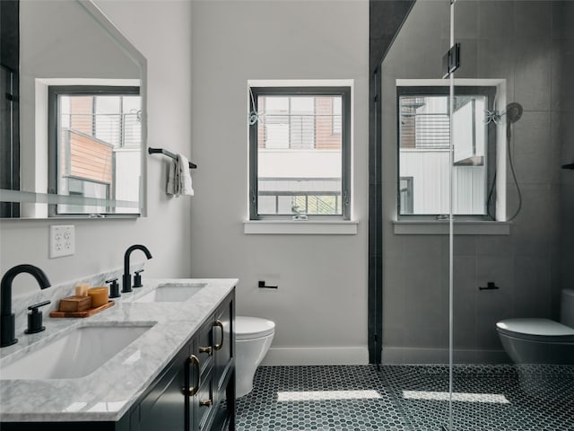 412 Kemp St, Austin, TX 78741 - bathroom featuring double vanity, a shower stall, and tile patterned floors