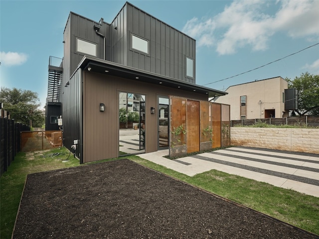 412 Kemp St, Austin, TX 78741 - rear view of house featuring board and batten siding