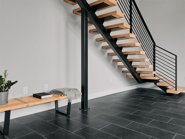 412 Kemp St, Austin, TX 78741 - stairs featuring baseboards
