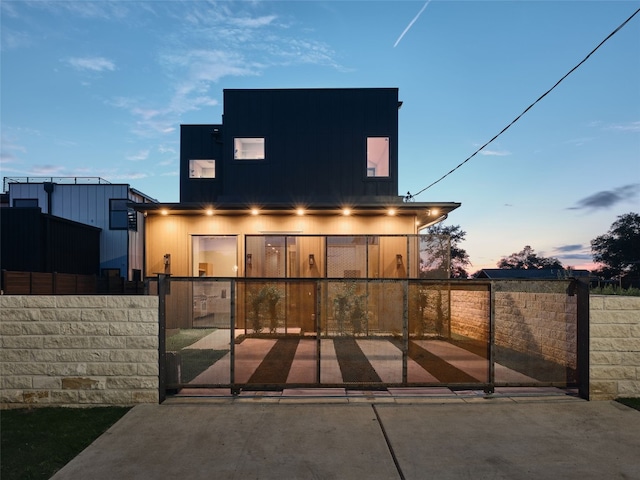 412 Kemp St, Austin, TX 78741 - view of front of home featuring a fenced front yard, a gate, and board and batten siding