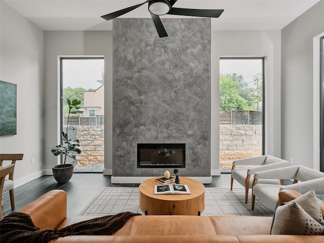 412 Kemp St, Austin, TX 78741 - living area featuring a tile fireplace and ceiling fan