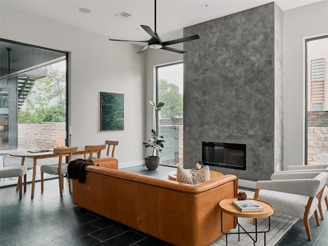 412 Kemp St, Austin, TX 78741 - living room featuring ceiling fan, a fireplace, and recessed lighting