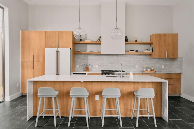 412 Kemp St, Austin, TX 78741 - kitchen featuring open shelves, high quality fridge, backsplash, and light countertops
