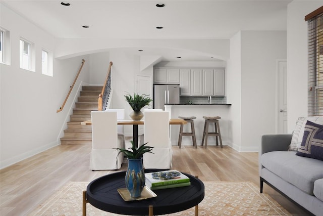 3406 Menchaca Rd Unit 14, Austin, TX 78704 - living room with stairway, light wood-style flooring, and recessed lighting