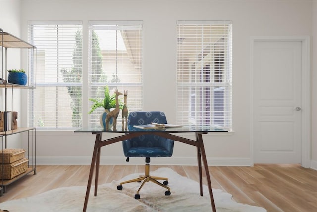 3406 Menchaca Rd Unit 14, Austin, TX 78704 - home office featuring wood finished floors and baseboards